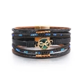 Dettaglio macro del bracciale bohémien multistrato in pelle con chiusura magnetica e strass - Nero (SZ00338-6)