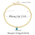 Detail van turquoise hanger ketting met afmetingen en handige karabijnsluiting - Gouden Ringketting Onregelmatige Turkoois Hanger (KN0109)