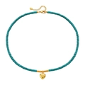Handmade turquoise beaded necklace featuring a polished gold heart-shaped pendant - Heart Turquoise Necklace
