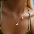 Elegant 18K gold-plated necklace with fishtail pendant and pearl on female neck - Fish Tail Pearl Necklace (KN0421)