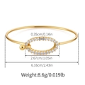 Detail of gold-plated bangle showing dimensions, zircon-set oval piece, and spherical clasp - Pave Oval Buckle Design (KB0569)