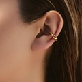 Detail of a golden twisted spiral ear cuff on a female model with a high-polished finish - Spiral Braided Texture Style (KE1474)