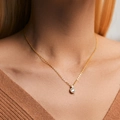 Elegant gold necklace featuring a circular halo pendant with a sparkling clear center stone - 18K Gold / Double Ring Gem Style (KN0318)