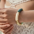 Detail of colorful acrylic beaded bracelet on model in white lace top with golden accents - Color Block Marble Style (AB0009-17) / White Green Block