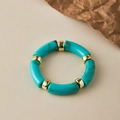 Macro view of teal marbled acrylic segments and gold metal spacers on elastic bracelet - Teal Marble (AB0008-29)