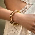 Detail view of bohemian beaded bracelet featuring leopard print and gold metal tubes on wrist - Glossy Leopard Style (AB0009-27) / Yellow