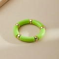 Detail of green acrylic tube beads and gold metal spacers on an elastic ring - Bright Green (AB0008-20)