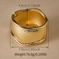 Exaggerated golden alloy bangle with irregular hammered texture and 4.4cm width - Hammered Texture Gold Wide Bangle (SZ60788-3)
