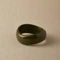Macro detail of sculptural deep green acrylic bangle with high-gloss mirror finish texture - Random Pattern / Dark Green Streamline (AB0041-7)