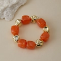 Détail de perles en acrylique marbré orange et perles métalliques dorées irrégulières - Marbre Orange (AB0050-15)
