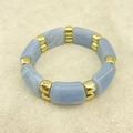 Detail of blue marble acrylic bamboo bracelet with gold metal spacers on beige surface - Light Blue Marble Rectangular Block (AB0040-8)