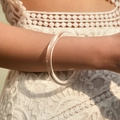 Modern minimalist clear acrylic round bangle bracelet for women on lace dress background - Minimalist Fully Transparent Ring Style (AB0032-1)