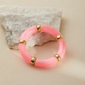 Close-up of pink marbled acrylic bamboo-style stretch bracelet with gold spacer beads - Pink Silk Texture (AB0008-15)