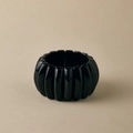 Close-up of a wide glossy black modular resin bracelet with an elastic stretch design - Glossy Black (AB0063-8)