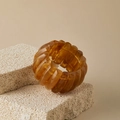 Detail of amber acrylic chunky stretch bracelet displayed on a natural stone prop - Amber (AB0063-5)