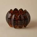 Macro shot of polished wide leopard print acrylic bracelet with tortoise shell texture - Brown Yellow Leopard (AB0062-7)