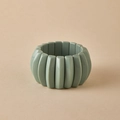 Close-up of sage green beaded acrylic stretch bracelet with polished marble texture - Sage Green (AB0063-10)