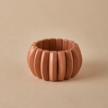 Macro view of a wide elastic bangle with vintage Maillard style oval pink resin tiles - Terracotta Pink (AB0063-11)