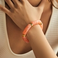 Detail of bohemian acrylic bamboo bracelet with coral pink marble resin and gold beads - Coral Pink Marble (AB0008-5)