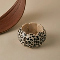 Detail of leopard print resin petal bracelet with elastic cord on beige background - Beige Leopard (AB0061-3)