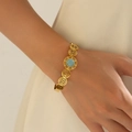 Bracciale aperto dorato bohémien con pietra turchese, zirconi e motivi a cerchi - Pietra Principale Celeste Boema (SB0014)