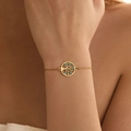 Gold stainless steel bracelet with tree of life charm and blue heart detail on wrist - Stainless Steel / Tree of Life (SB0007)