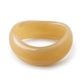 Macro view of polished wide acrylic bangle with amber-toned translucent marble texture - Translucent Warm Yellow Thick Style (AB0041-1)