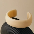 Polished milky white wide resin bangle with smooth glossy finish on wave tray - Creamy White Wide Cuff Style (AB0057-2)