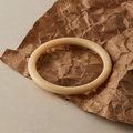 Minimalist cream white resin bangle with a smooth polished finish on kraft paper - Minimalist Creamy Ring Style (AB0052-1)