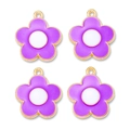 Macro detail of four purple enamel flower charms with gold plating for DIY jewelry making - Purple