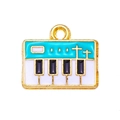Detailed macro view of piano key enamel charm with blue and gold alloy finish - Blue