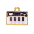 Macro detail of alloy piano key pendant with black and white enamel and gold plating - Black
