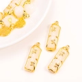 Close-up of bamboo jade pendant with gold leaf accents and Fu character charm - Stepped