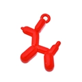 Detailed view of red resin balloon dog pendant with high-gloss finish for DIY jewelry - Red