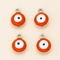 Dettaglio di quattro ciondoli occhio del male arancioni con anelli d'argento per gioielli DIY - Arancione/Tono Argento