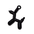 Detail shot of a glossy black balloon dog pendant with a sturdy metal ring attachment - Black