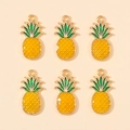 Detailed view of six yellow and green enamel pineapple pendants for jewelry making - Pineapple Shape (px0865-3)
