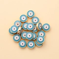 Macro detail of 10mm gold evil eye alloy beads with blue enamel for DIY jewelry making - Round Style (px0942-1)