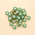 Macro detail of 10mm gold-plated green evil eye beads for DIY jewelry making - Round Style (px0942-4)
