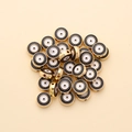 Close-up of 10mm golden alloy evil eye charms for handmade jewelry making - Round Style (px0942-6)