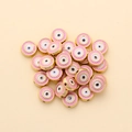 Detail view of 10mm pink enamel evil eye beads with gold gear edge for DIY jewelry - Round Style (px0942-7)