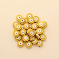 Macro shot of 10mm yellow enamel evil eye beads with golden edges for DIY jewelry making - Round Style (px0942-8)