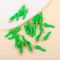 Detailed view of green chili enamel charms with golden metal rings for jewelry making - Green