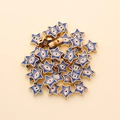 Macro detail of 10mm star shaped evil eye beads with gold plating for DIY jewelry making - Star Shape (px0942-11)