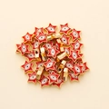 Macro detail of star shaped evil eye beads with red enamel and gold metal finish - Star Shape (px0942-13)