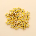 Detail of yellow star-shaped evil eye beads with golden edges for DIY jewelry making - Star Shape (px0942-16)