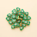 Close-up of heart-shaped evil eye charms with green enamel for DIY jewelry making - Heart Shape (px0942-20)