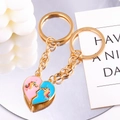 Detail of pink and blue enamel heart magnetic keychains with unicorn design and gold finish - Unicorn Heart Style (px0958-1)