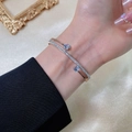 Elegant rose gold double-layered titanium steel bangle with shimmering cubic zirconia - Rose Gold
