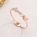 Minimalist rose gold butterfly and heart bangle with cubic zirconia pavé detailing - Rose Gold